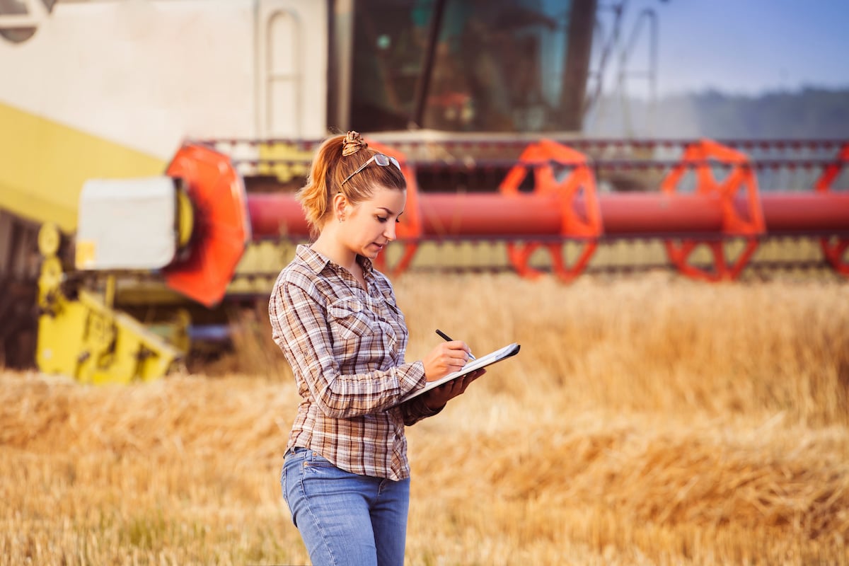 farmer-writing-on-clipboard farmer-writing-on-clipboard